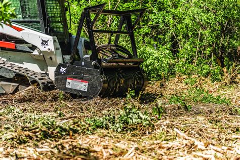 can i clear land with a skid steer|bobcat attachments for clearing brush.